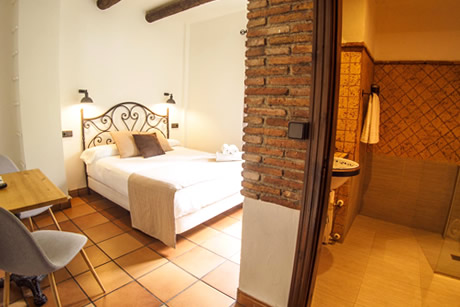 room with brick wall in the baclon neves hotel