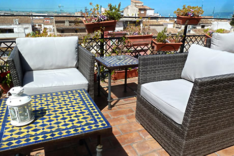 summer terrace with armchairs at federico's house