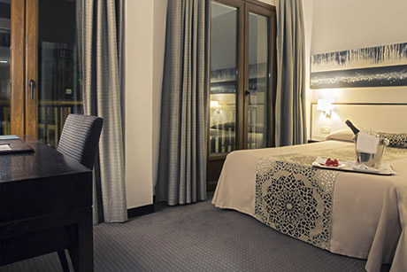 double room with table in macia plaza