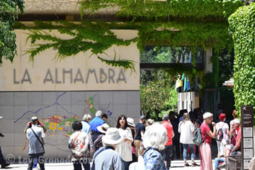 alhambra entrance with people waiting to buy tickets