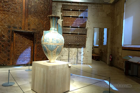 wooden gate and amphora in alhambra museum