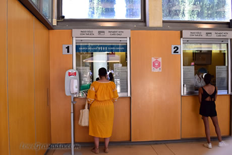 one person at the ticket office window of the alhambra