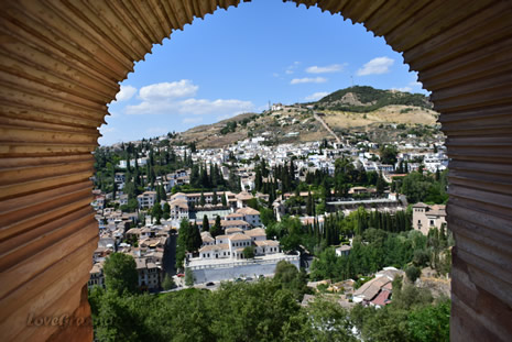 view of the albaicin from the arch of the alhambra palace