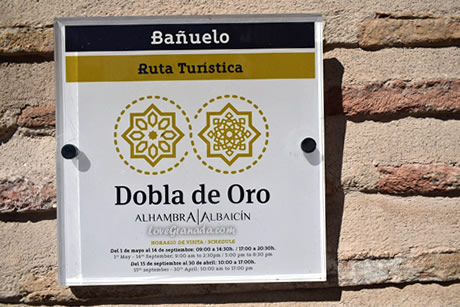 dobla de oro sign on the wall