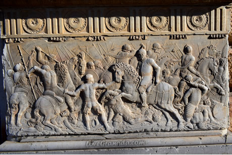 battle between christians and arabs on the facade of the palace of carlos v
