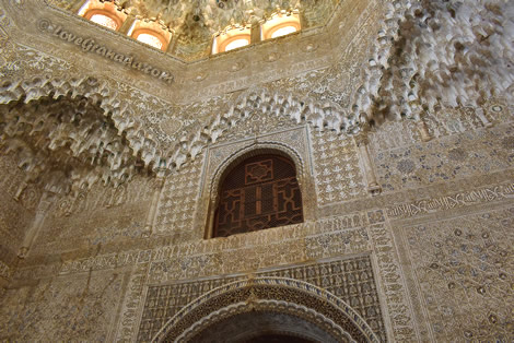 arches with arabic decoration in the room of two sisters in the alhambra