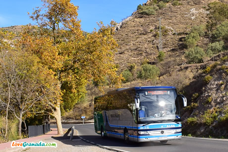 bus parked at a stop on the way to capileira
