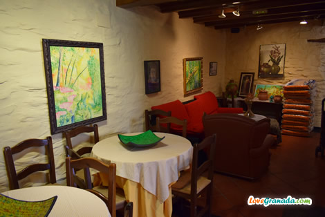 nice interior with barrels and tables in Castano restaurant in Capileira