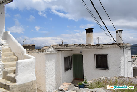 beautiful street with flowers in capileira