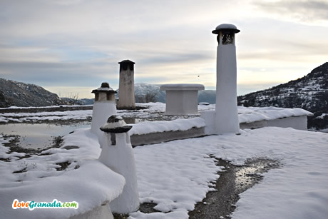 snow on the roofs of capileira