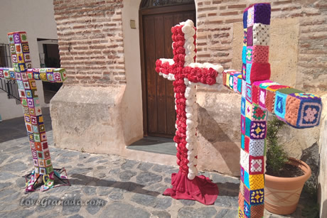 three crosses decorated with flowers