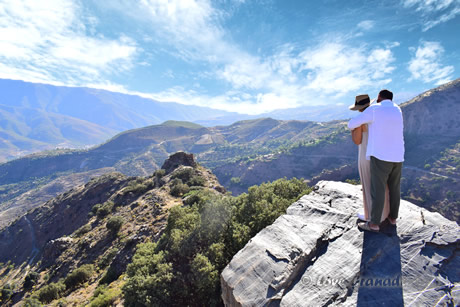 a couple watching views in poqueira ravine