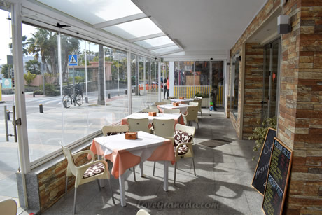 tables and glass terrace in the restaurant sabina