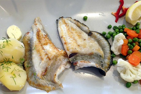plate of grilled fish in the restaurant in almuñecar