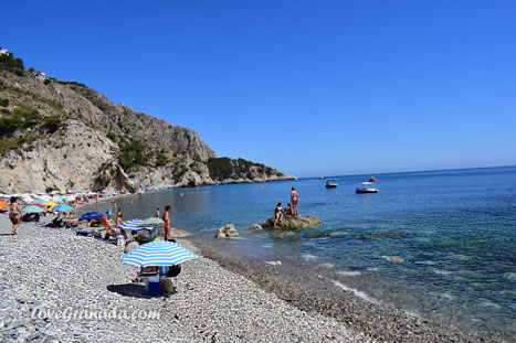 pebbles and clean water on the beach of cantarrijan