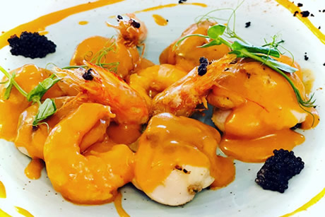 a dish of shrimps in souce in mar dela restaurant
