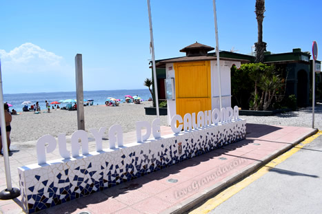 sign and shower on the beach of calahonda