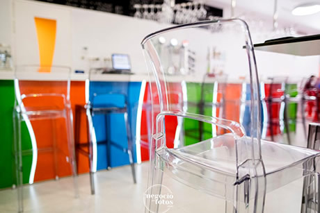 modern bar with transparent chairs in the hostel tropical