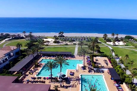 two swimming pools in front of the sea in playa granada club resort in motril