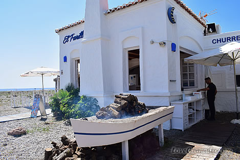 restaurant with boat on the beach of calahonda in motril