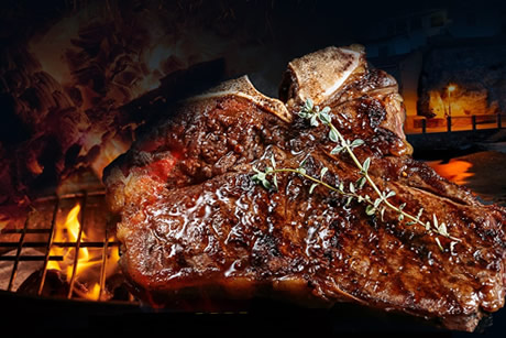 barbeque grilled steak in bar manolo in salobreña