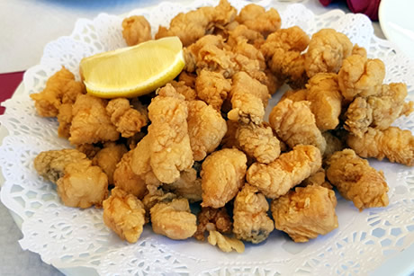 plate of fried fish in restaurant pesetas
