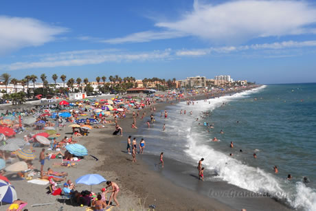 beach charca full of people in summer in salobreña
