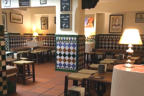 tables in the interior of bar trastienda