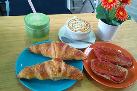 breakfast cafe, toast, croissants in mimi coffee shop in granada