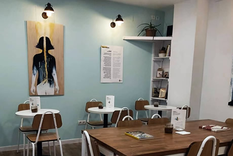 interior with tables in perspectives cafe in granada