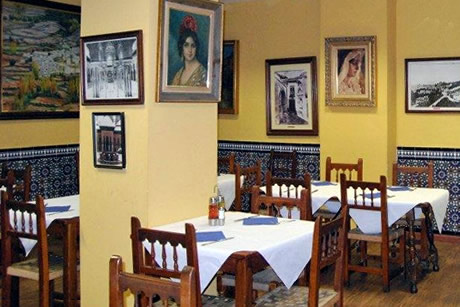traditional interior of el molino restaurant with chairs and tables