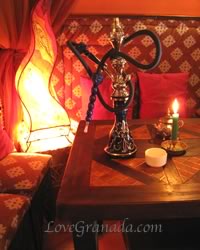 table with cushions inside of granada tea house