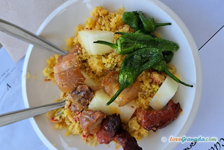 migas plate with peppers and meat.