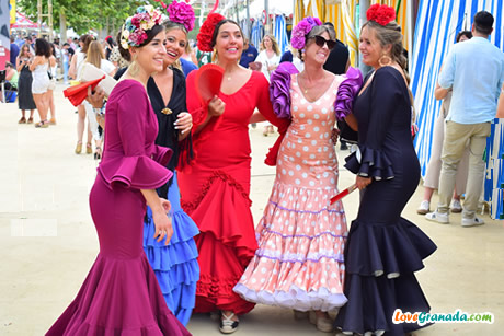 happy girls in flamenco dresses in celebrations of corpus granada