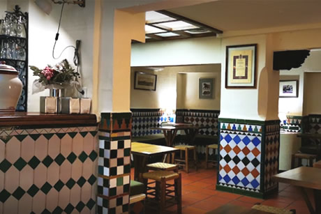 interior with tables of the bar trastienda in Granada