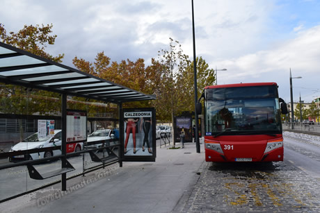 urban bus stopped in front of the bus station