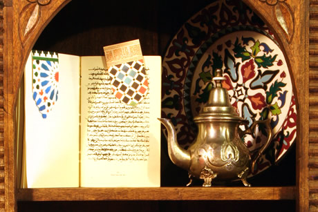 tea and book in arab baths of granada