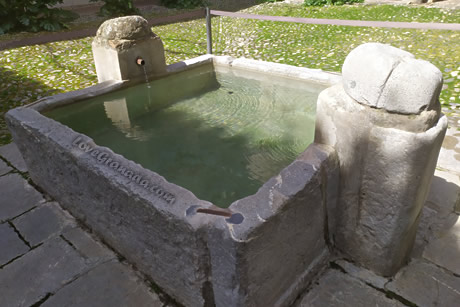 simple old well with water running