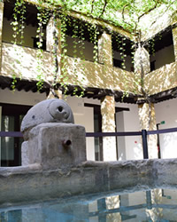 center square made of stone with side pipes