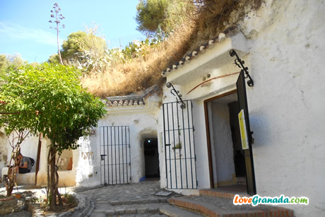 garden and open doors to the caves of the museum