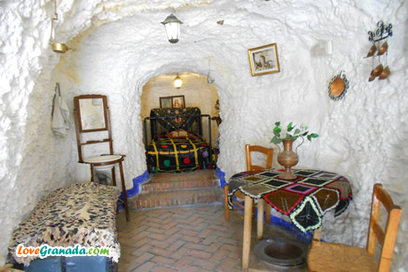 living room and bedroom with bed and table