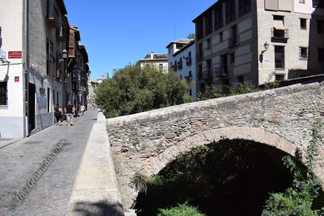 stone bridge across river darro