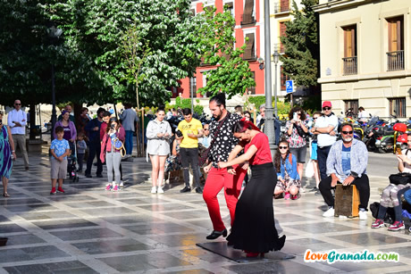 a couple dancing flamenco in plaza nueva