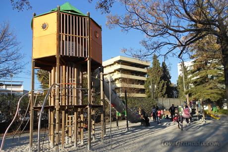 swings with children playing in granada