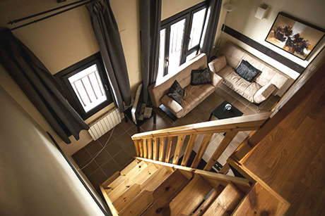 wooden stairs to the bedrooms in apartment building boabdil