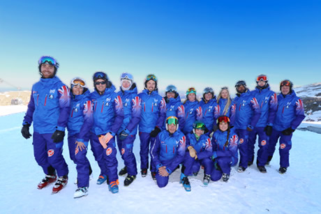 group in blue jackets in ski school british ski center