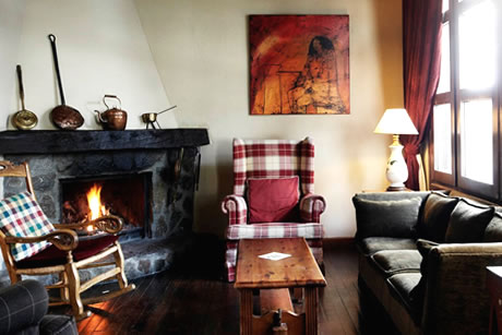 fireplace in the common rooum in hotel hg maribel