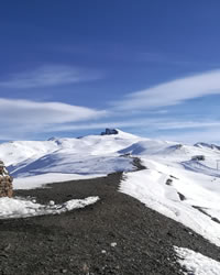 sierra nevada mountains with veleta in snow