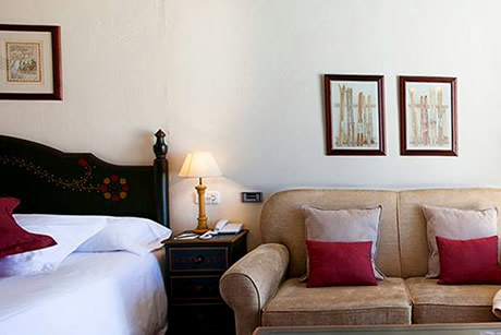 double room with table and window with views at vincci rumaykiyya