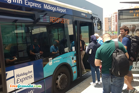 people getting on the bus from Malaga to the airport